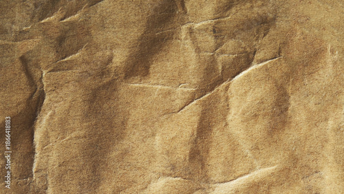 Brown crumpled craft paper background. Old texture eco waste recycling concept. 
