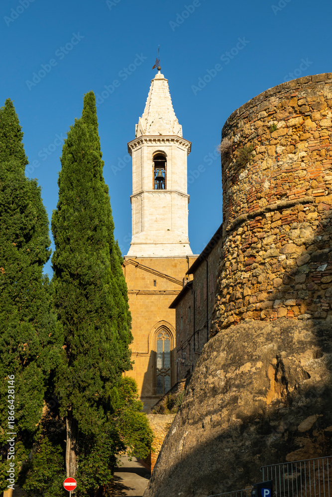 Naklejka premium Bell tower and stone wall in Pienza, Tuscany