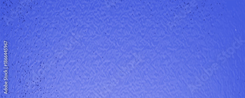 Uniform solid vibrant blue concrete surface. Selective Focus.