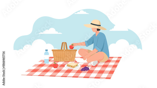 Leisurely Outdoor Picnic Scene Featuring a Woman Relaxing on a Blanket