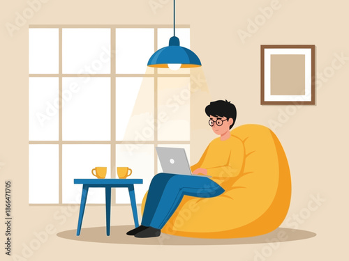 A man sitting on a yellow bean bag chair working on a laptop next to a table with two cups in a cozy room