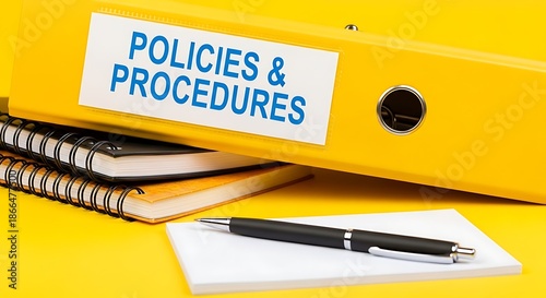 Important business policies and procedures manual resting on notebooks ready for review