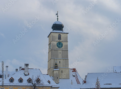 clock tower front view in main square with christmas tree lights decoration 