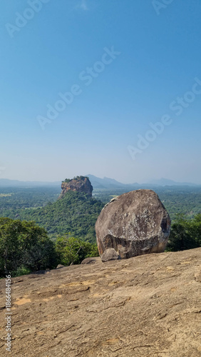 Iconic Sigiriya Rock surrounded by lush greenery. Sri Lanka.