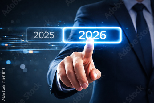 Businessman switching to 2026 by pressing button