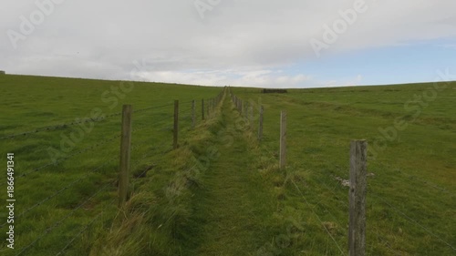 Walking along a path in the Orkney Islands