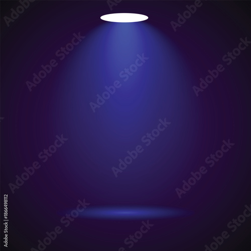 Spotlight shining down on a dark background with blue light