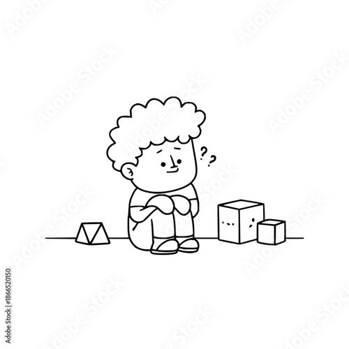 Sad Boy Sitting with Blocks Feeling Sadness