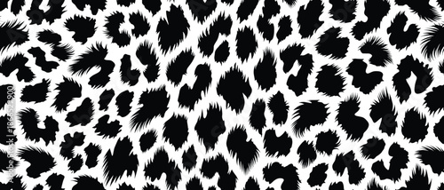 Striking black and white abstract leopard print pattern, a captivating animal fur skin texture reflecting the wild beauty of Africa, an iconic and versatile African design