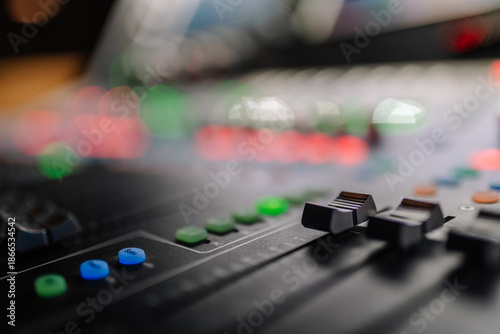 Wallpaper Mural Close-up view of a professional audio mixing console with colorful buttons and sliders, showcasing intricate details of sound engineering and music production equipment Torontodigital.ca
