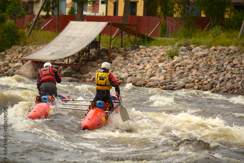 A man is floating down a turbulent river in a boat