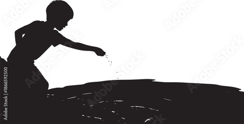 A child playfully scattering seeds on the ground a striking silhouette