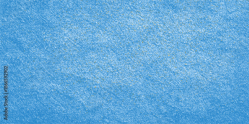 A closeup of a clean blue towel fabric material reveals a wet, textured surface with a cold winter ice pattern, perfect for a swimming pool wallpaper design or grunge textile backdrop