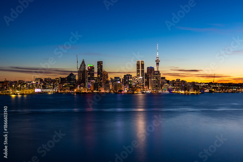 Auckland City Skyline at Night with Sky Tower Reflections on the Harbour