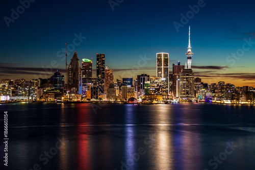 Auckland City Skyline at Night with Sky Tower Reflections on the Harbour
