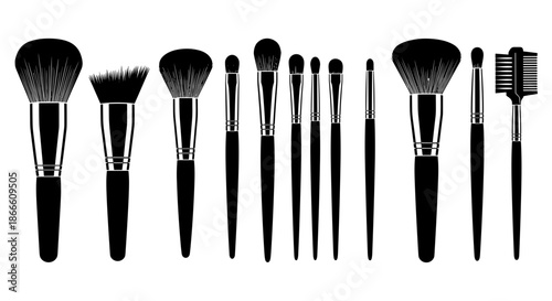 Set of various makeup brushes and tools arranged in a row
