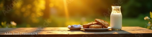 Golden hour light bathes a weathered wooden table set for breakfast with milk and crusty bread outdoors , farm fresh, bowl, table
