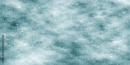 A bright blue abstract sky background featuring a white winter snow texture with cold frost patterns and soft clouds for a seasonal nature wallpaper