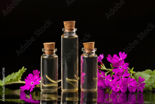 primrose essential oil in  beautiful bottle on table