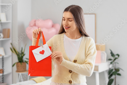 Young woman with love lette...