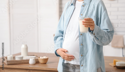 Young pregnant woman with d...