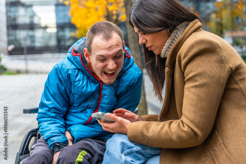 Foto Caretaker and disabled man sharing a happy moment outdoors