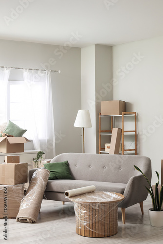 Sofa with rolled carpet and...