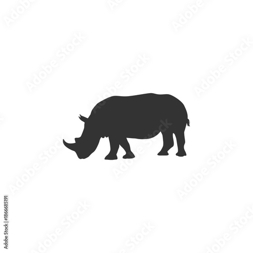 Gray rhinoceros silhouette walking in profile view