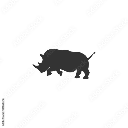 Gray rhinoceros silhouette walking in profile view