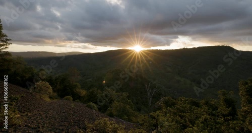 Scenic panoramic sunset views with starburst effect from Table Top Mountain lookimng towards Picnic Point park, Toowoomba, Queensland, Australia