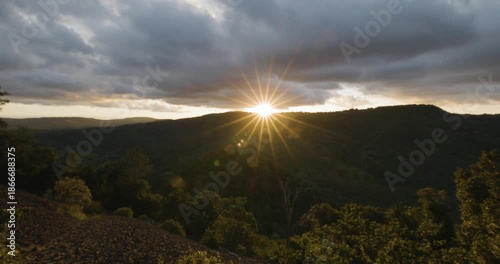 Scenic panoramic sunset views with starburst effect from Table Top Mountain lookimng towards Picnic Point park, Toowoomba, Queensland, Australia