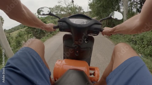 POV. Ride scooter with propane tank LP.