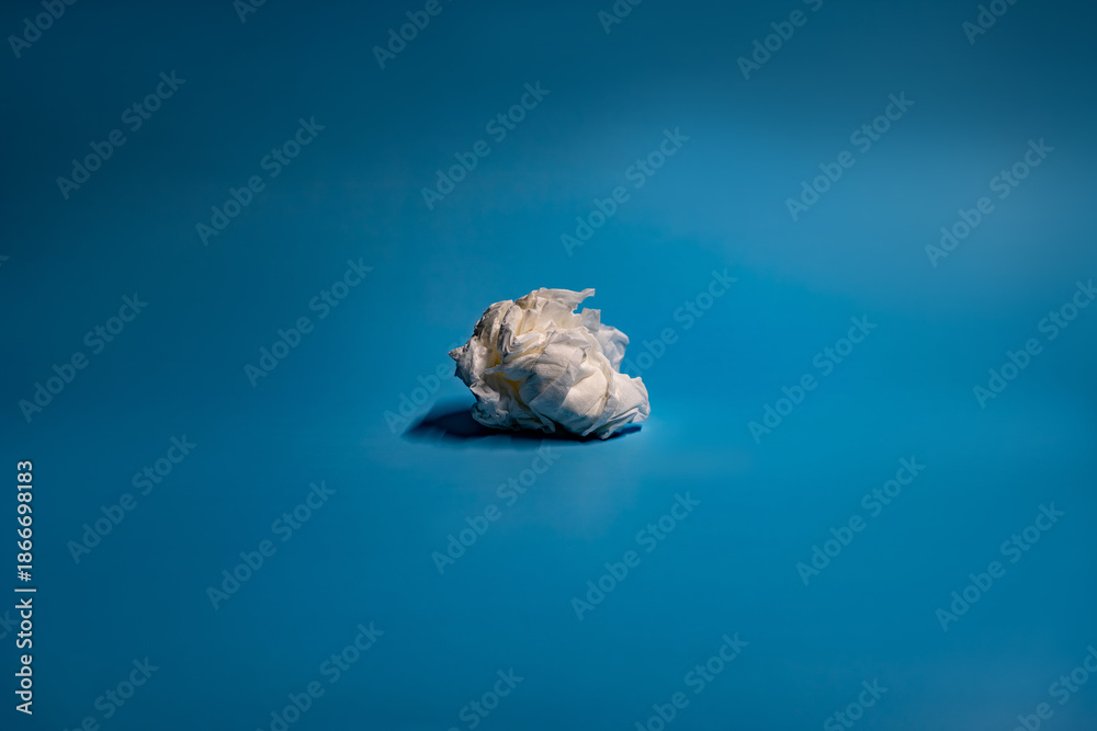 Fototapeta premium used tissue looks like a cloud in a blue background