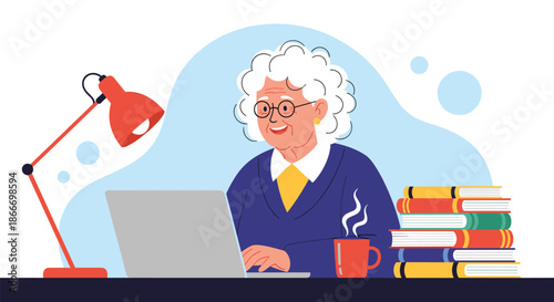 Smiling elderly woman with glasses uses a laptop at a desk with books a lamp and a cup of coffee for online learning.