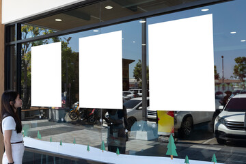 Three Blank Poster Mockups on Storefront Window with Woman and Urban Street Reflections