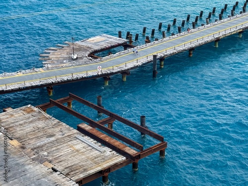 Aerial view of long wooden deck over the ocean
