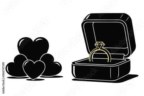 Black hearts and gold diamond ring in open jewelry box on white background