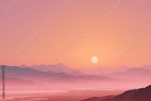 Serene mountain range silhouetted against a peach and pink sunset sky