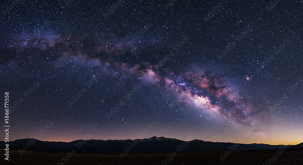 Obraz premium Breathtaking milky way galaxy over mountainous landscape