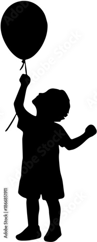 Silhouette of a little boy holding a balloon and looking up