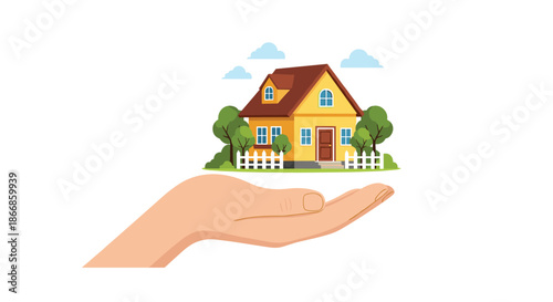 Human hand carefully holds a small yellow model house with a red roof surrounded by green trees and a white fence representing real estate.