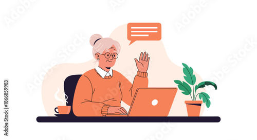 Cheerful elderly woman sitting at a desk and waving her hand during a video call on a laptop in a cozy colorful room.