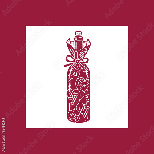 Wine bottle elegantly wrapped with grapevines and ribbon