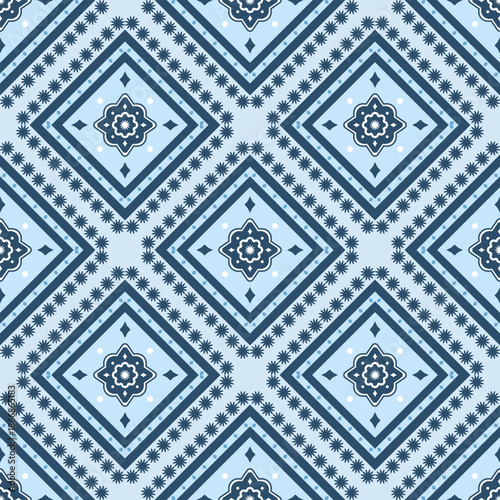 Seamless geometric pattern featuring tribal diamond shapes in blue tone for fabric, craft, and textile design.