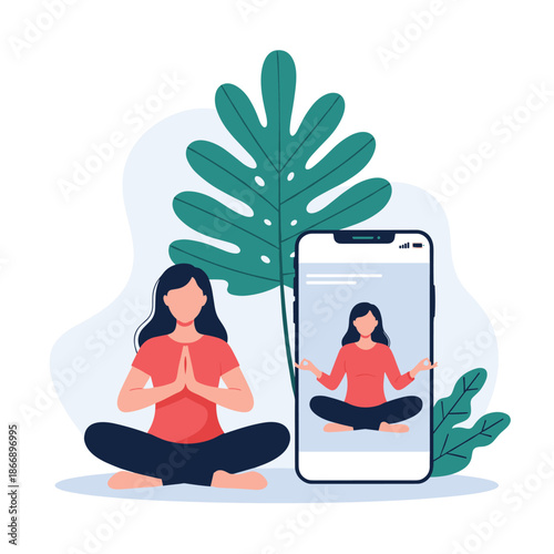 Young woman practicing yoga and meditation at home while following an online tutorial video on her smartphone screen.