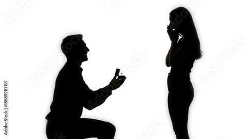 Man proposing to woman on one knee with ring in hand