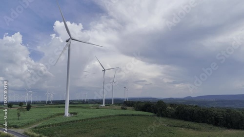 Wind turbines at green mountain hill clean sustainable electricity power, Green generator cloudy blue sky