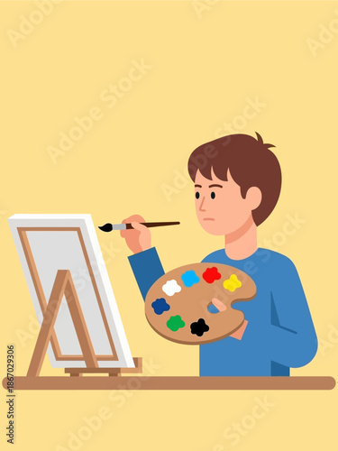 A young boy enthusiastically paints on a canvas using a palette of vibrant colors, showcasing his artistic passion and creativity in a studio setting