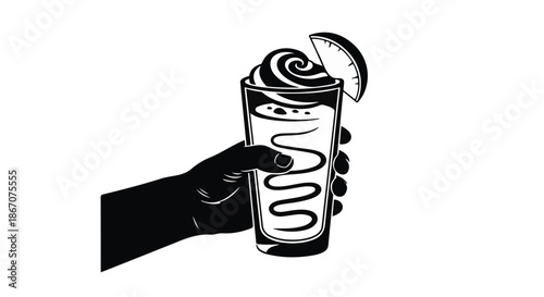Hand holding a refreshing, ice-cold beverage with whipped cream and a lime garnish