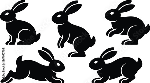 Various black rabbit silhouettes captured in different resting and alert positions on a simple white backdrop